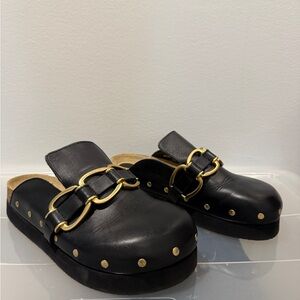 maje Black Leather Clogs with Gold Accents